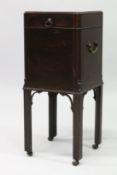 A GEORGE III MAHOGANY CELLARETTE, the hinged top opening to reveal four lead lined compartments, the