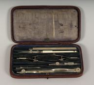 AN ARMY AND NAVY SET OF DRAWING INSTRUMENTS in a leather case.