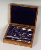 A GOOD SET OF DRAWING INSTRUMENTS in a mahogany case. A Windsor.