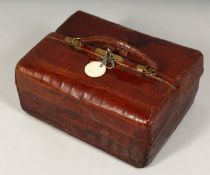 A GENTLEMAN'S MAPPIN & WEBB LEATHER FOLDING DRESSING CASE with fitted interior with silver top