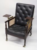 A GOOD 19TH CENTURY MAHOGANY BERGERE LIBRARY ARMCHAIR with cane work back, arms and seat with button