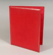AN ASPREY RED LEATHER FOLDER. 12ins x 10ins.
