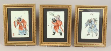 A SET OF THREE CHINESE PORCELAIN PANELS in gilt frames of Chinese figures. 7.5in x 5ins.