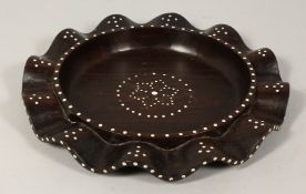 AN INDIAN IVORY INLAID HARDWOOD SHAPED CIRCULAR DISH. 12ins diameter.