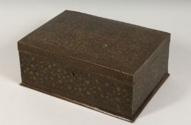 AN INDIAN BRASS BOUND ENGRAVED LIDDED BOX, the box engraved all over with foliate decoration . 14ins