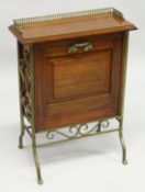 AN EDWARDIAN MAHOGANY RECTANGULAR MAGAZINE RACK with brass gallery, fold down front with three