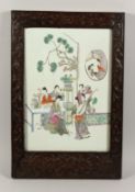 A VERY GOOD FAMILLE ROSE PORCELAIN PANEL in a good frame painted with various figures. 16ins x