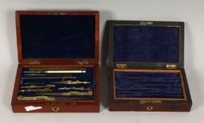 A SET OF DRAWING INSTRUMENTS in a mahogany case and a case (2).