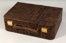A VICTORIAN LADIES CROCODILE VANITY CASE with silk interior and silver top bottles with initials J