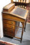 A Victorian rosewood and inlaid Davenport.