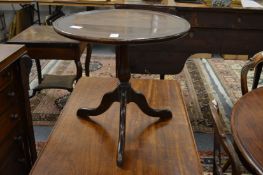 A mahogany tripod occasional table.