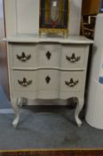 A continental painted two drawer chest.