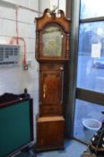 A 19th century mahogany and oak longcase clock with brass arched dial, eight-day movement, signed