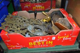 A box of decorative metal ware.