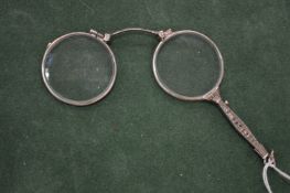 A pair of lorgnettes.