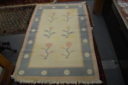A modern cream ground rug.