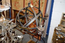 A set of three large unusual wrought iron spherical four light chandeliers.