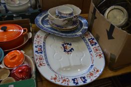 A large meat dish and similar items.