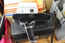 A cased cine camera.