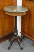 A marble topped occasional table.