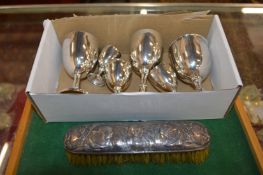 Silver goblets and a silver backed brush.