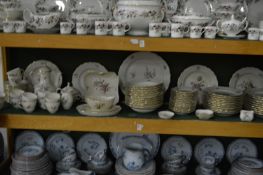 A comprehensive Royal Copenhagen dinner service with floral decoration.