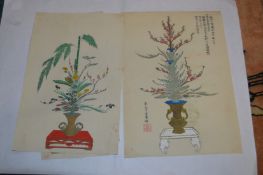 Three Japanese wood block prints of flowers.