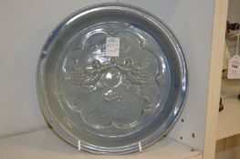 A Chinese moulded pottery dish.