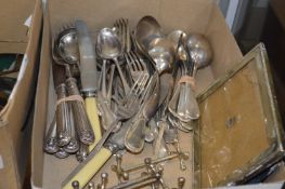 Various flatware and a plated photograph frame.