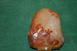 A Chinese carved agate snuff bottle.