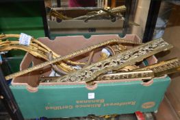 A box of decorative metal ware.