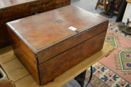 A Victorian walnut writing slope.