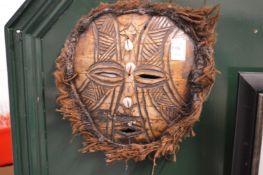 A Papua New Guinea turtle shell mask.