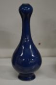 A small Chinese blue bottle vase.