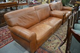 A large modern brown leather upholstered two seater settee.
