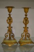 A pair of ormolu and onyx candlesticks.