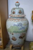 A large 20th century Chinese porcelain lidded urn decorated with European nautical scenes.