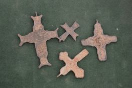 Four Roman bronze crosses.