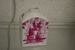 An early puce decorated pottery tea caddy.