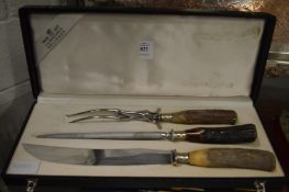 A cased carving set.