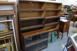 A pair of Simplex five section bookcases and a similar two section bookcase.