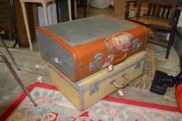 Two vintage suitcases.