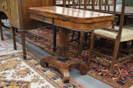 A 19th century rosewood D-shaped foldover card table.