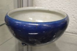 A Chinese blue pottery bowl (cracked).