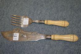 A pair of fish servers.