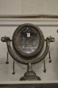 An eastern white metal framed dressing table mirror.