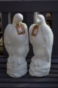 A pair of gatepost finials modelled as eagles.