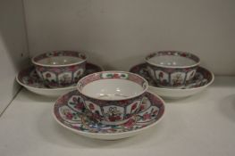 A set of three Chinese Famille Rose tea bowls and saucers.
