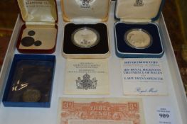 A silver coin dated 1565 and other items.