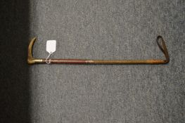 A silver mounted riding crop.